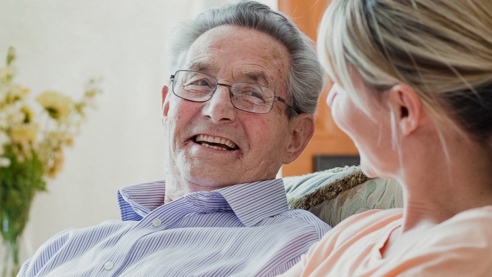 older person resting comfortably at home with family support