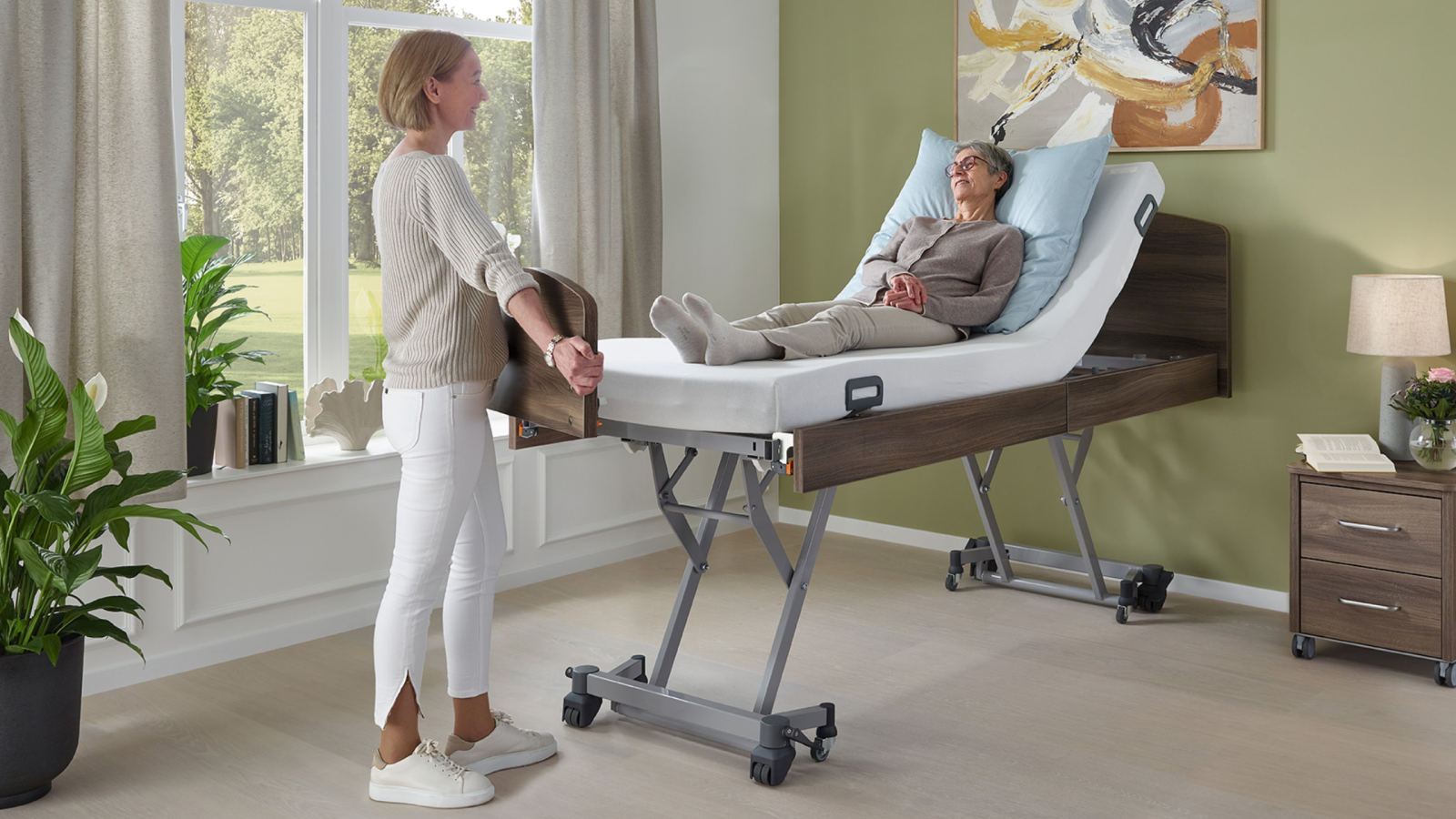 adjustable home care bed in showroom with mattress options