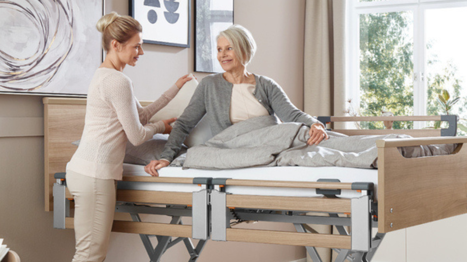Regia and Tereno home care beds displayed in showroom for comparison