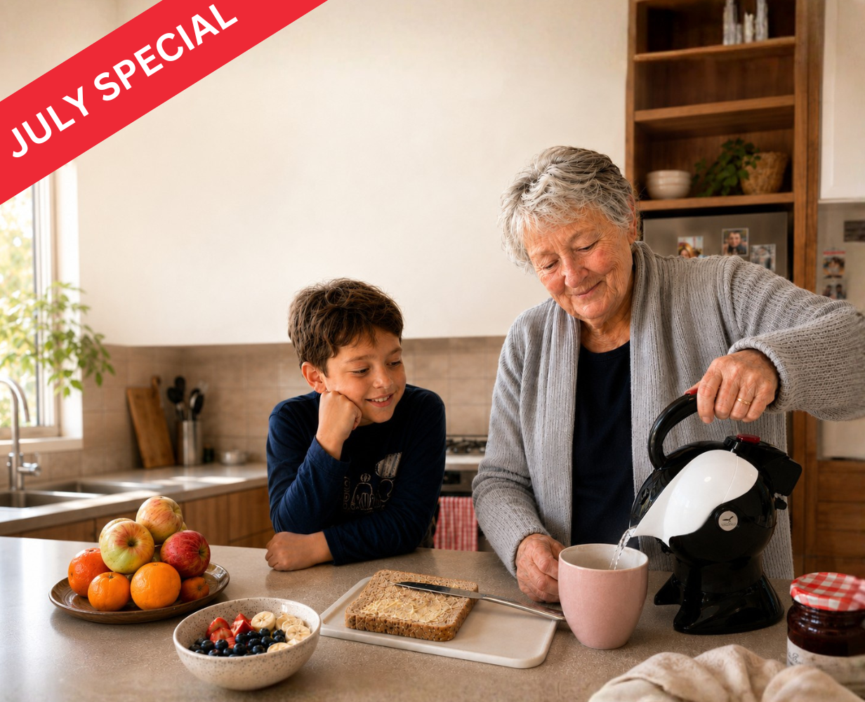 Older woman preparing breakfast with her grandson using a Uccello kettle, one-touch bottle opener and bread preparation board in a modern Australian kitchen. These products are on sale in July 2026.